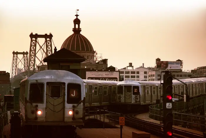 Two R42, J and Z trains pass each other at the Marcy Avenue station near the Williamsburg Bridge. 2011.
